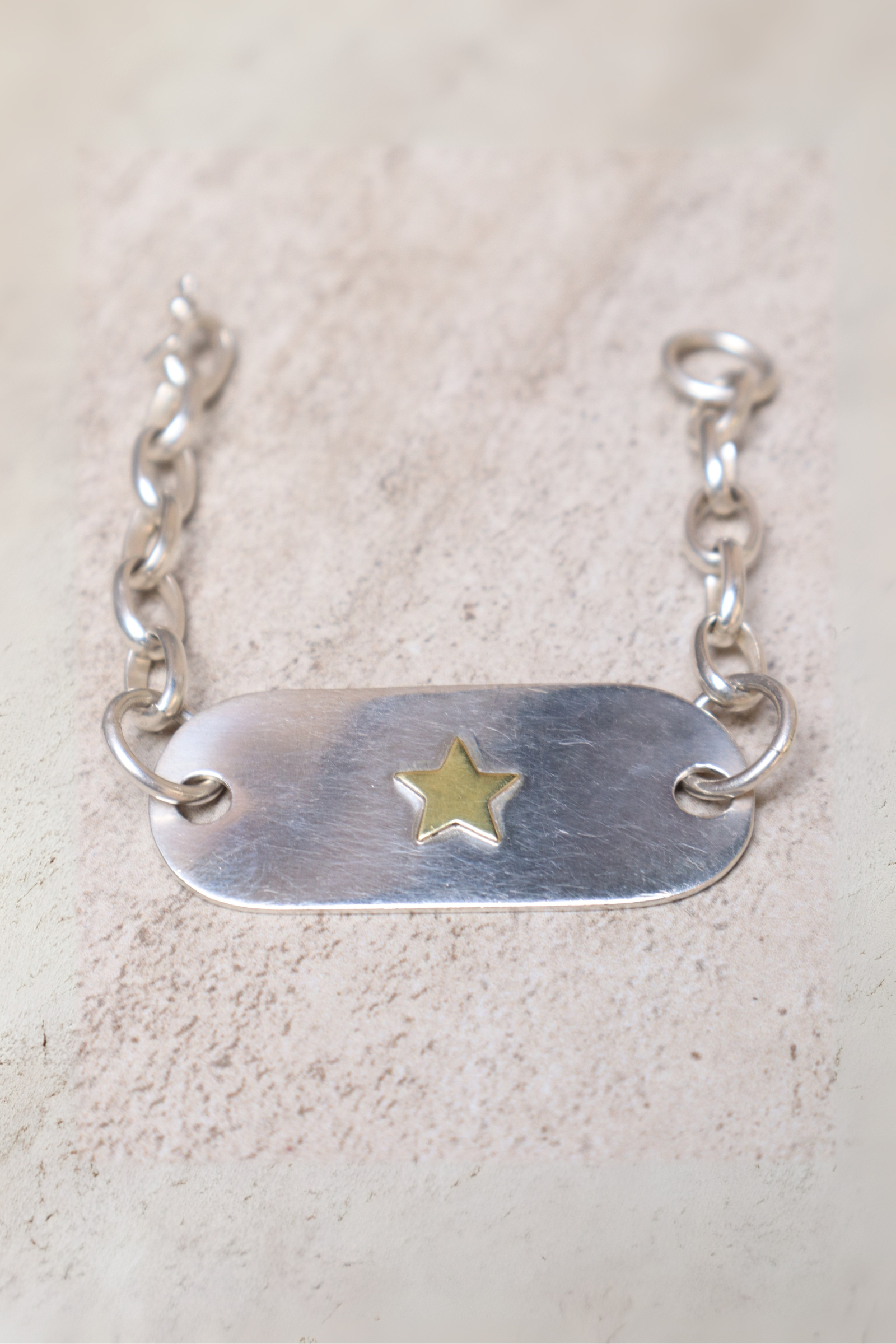 Pulsera placa plata estrella bronce