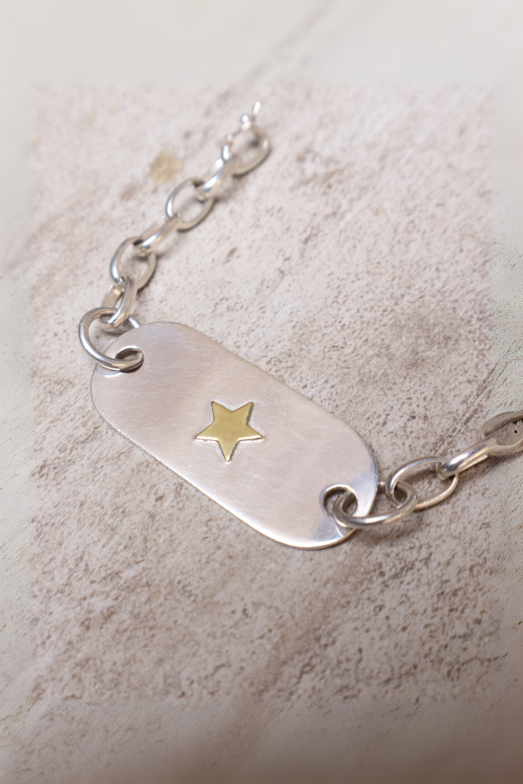 Pulsera placa plata estrella bronce