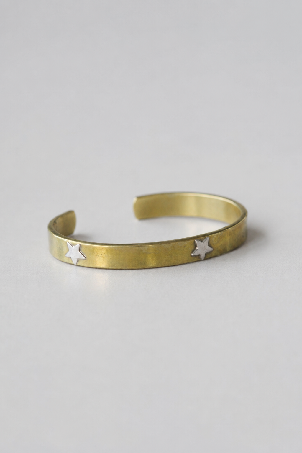 Esclava bronce estrellas plata