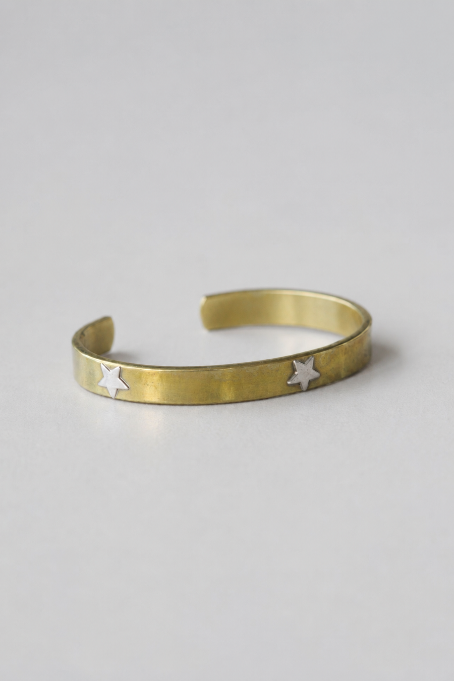 Esclava bronce estrellas plata
