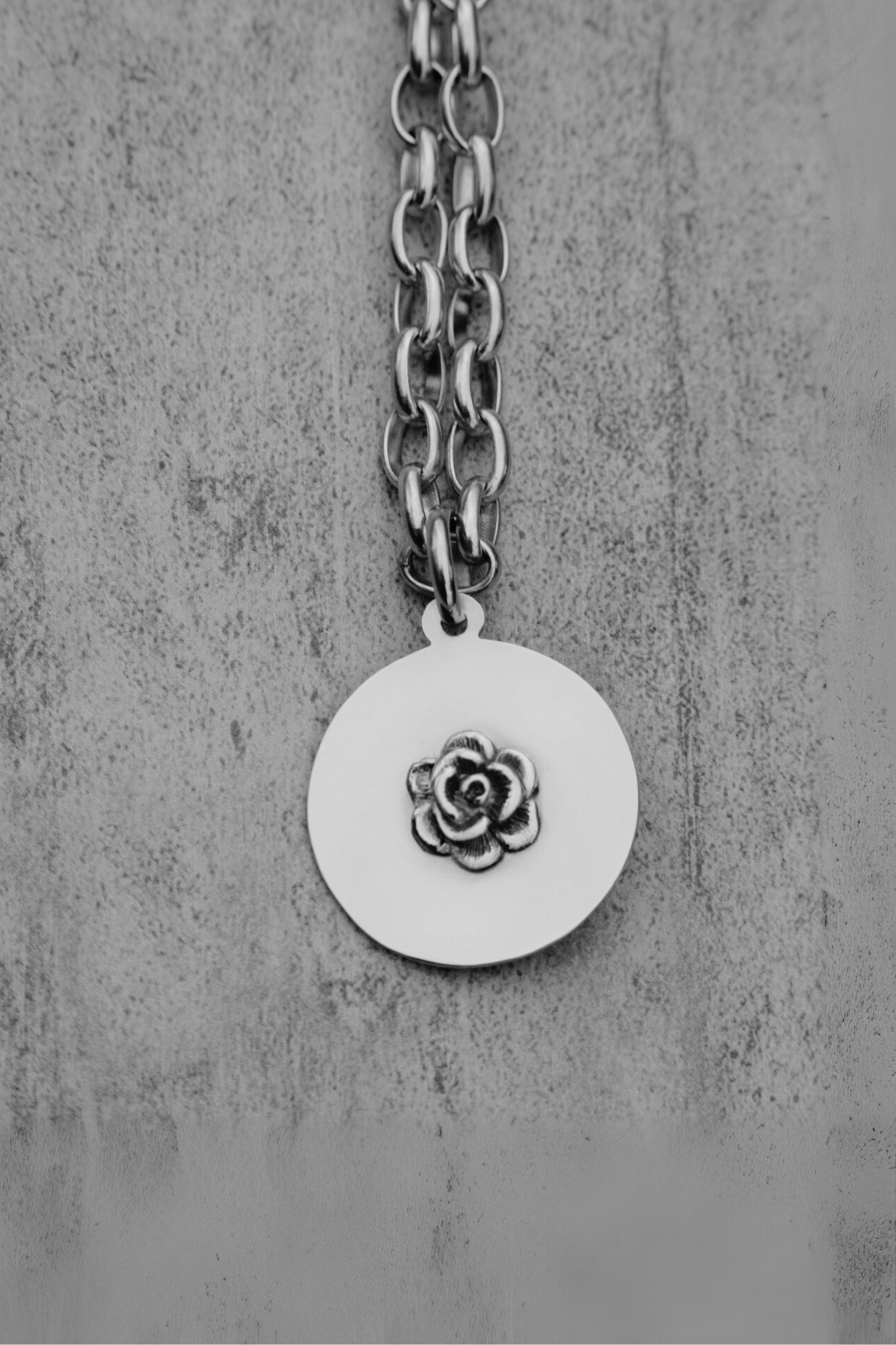 Colgante flor plata