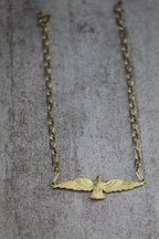 Collar águila plana