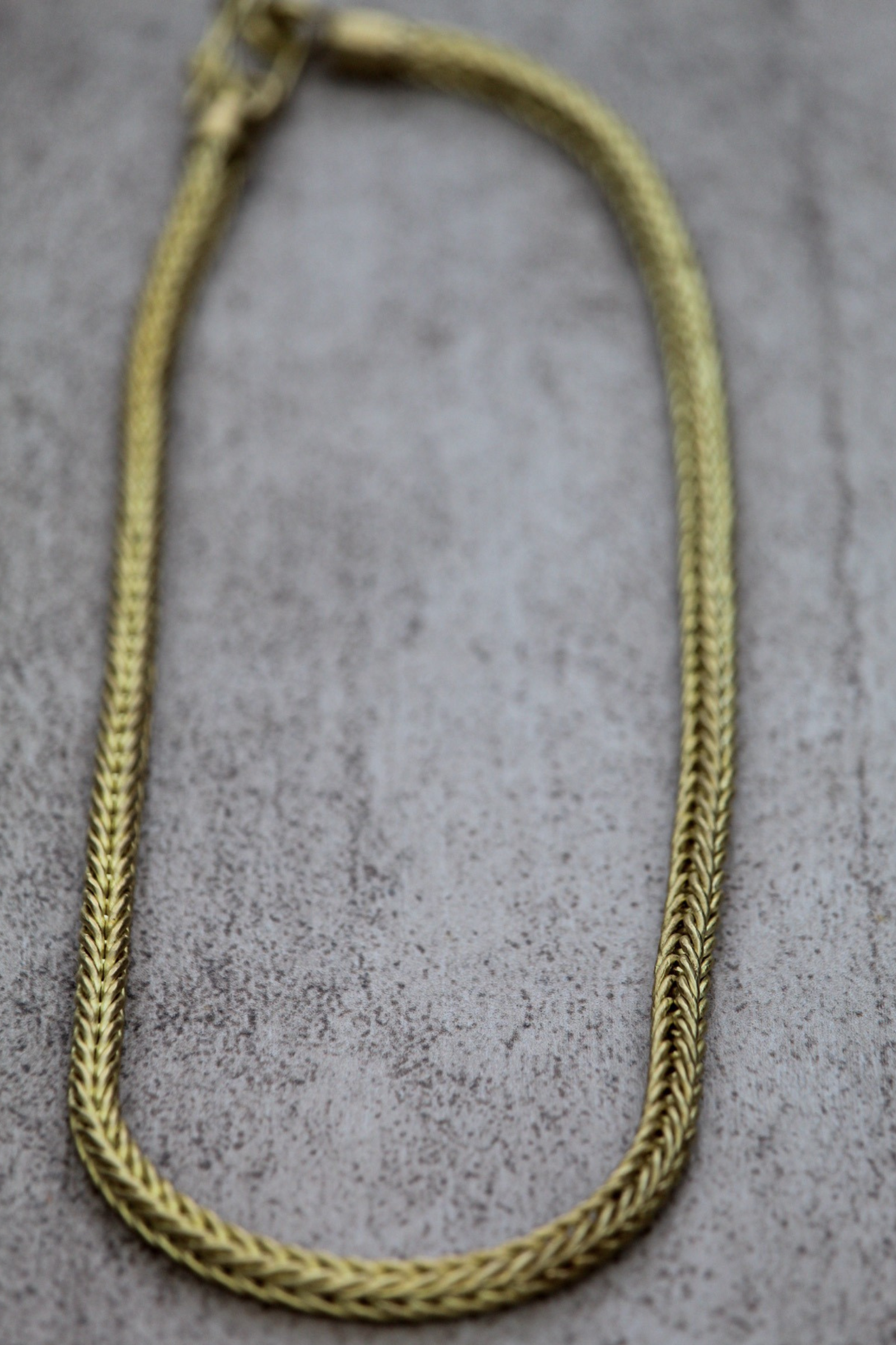 Cordón de bronce