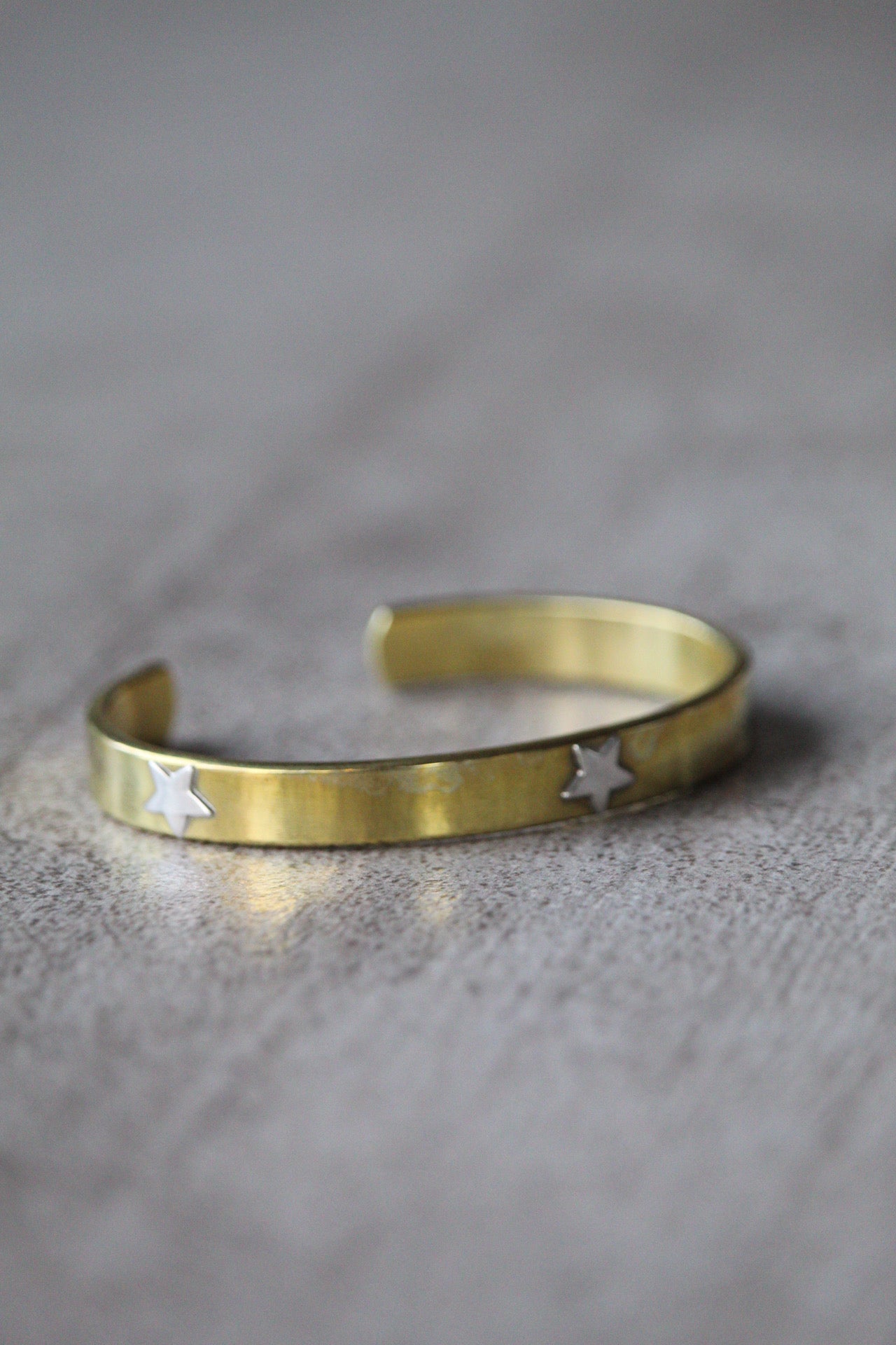 Esclava bronce estrellas plata