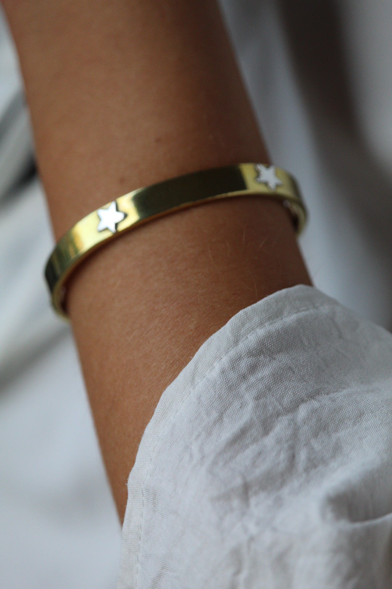 Esclava bronce estrellas plata