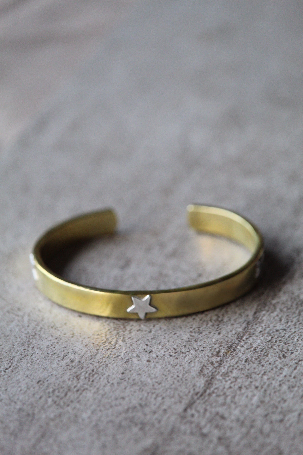 Esclava bronce estrellas plata