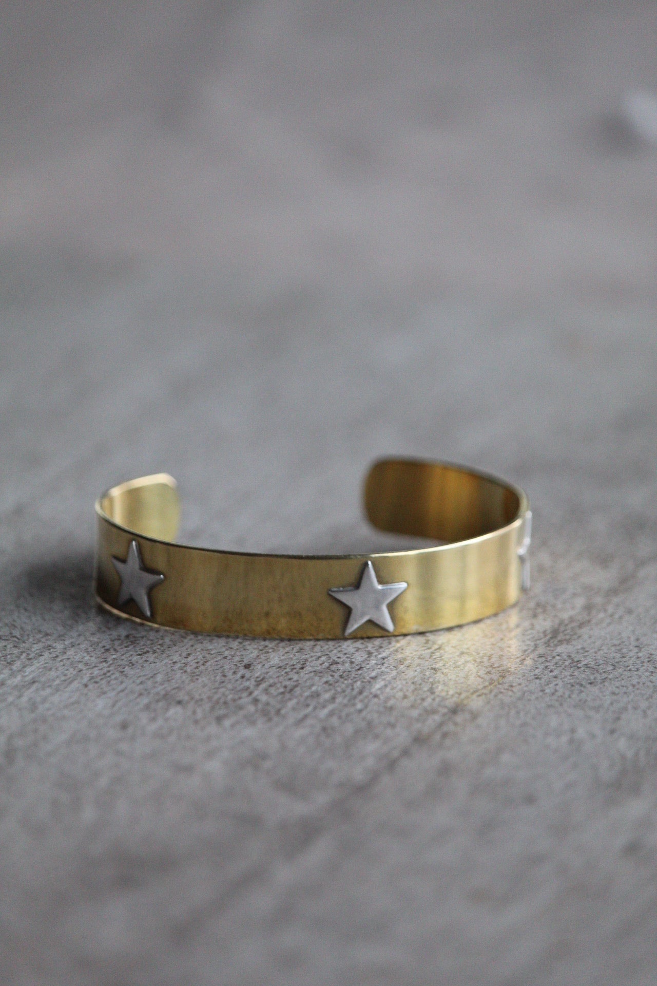 Esclava bronce estrellas plata