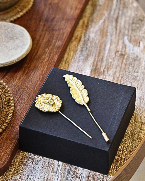 Prendedor pluma bronce