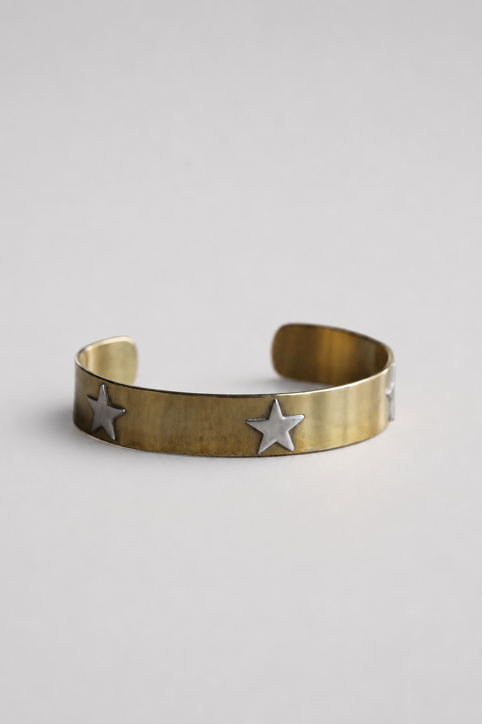 Esclava de bronce con estrellas de plata talla M de 1 cm — Co Rivera